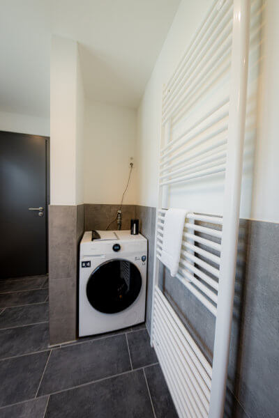 Bathroom with washing machine and dryer in the house - BONNYSTAY