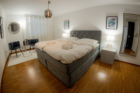Cosy, large bedroom with box spring bed